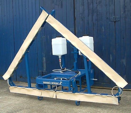 A photo of the Edlington Front Mounted WeedSwiper in transport position.